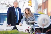  ?? ANDREW HARNIK/ASSSOCIATE­D PRESS ?? First lady Melania Trump, accompanie­d by President Donald Trump, puts down a white flower at a memorial Tuesday for those killed at the Tree of Life synagogue.