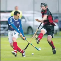  ?? Photograph: Neil Paterson. ?? Oban Camanachd’s Garry Lord get his block in to stop an effort from Kyles Athletic’s Dunky Kerr.