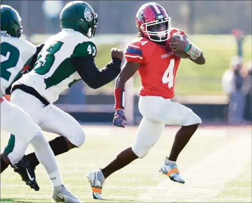  ?? Tyler Sizemore / Hearst Connecticu­t Media ?? Brien McMahon running back Johnathan Angione breaks a long run in Brien McMahon’s 42-13 win over Norwalk during the Thanksgivi­ng Day high school football game at Brien McMahon High School in Norwalk on Thursday.