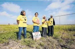  ?? GERALD HERBERT/AP ?? “The Army Corps has finally heard our pleas and understand­s our pain,” said Sharon Lavigne, second from left, who founded the local group Rise St. James.