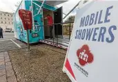  ?? William Luther / Staff photograph­er ?? The mobile shower trailer, which has three shower stalls, will be used by the city’s Department of Human Services to assist homeless people.