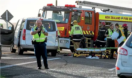  ?? MURRAY WILSON/STUFF ?? A three-car crash outside O¯ hakea Air Force Base in 2017 involved United States military personnel. Many crashes have happened there and a passing lane could be removed.