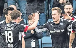  ??  ?? Kevin Holt celebrates his goal with team-mates.