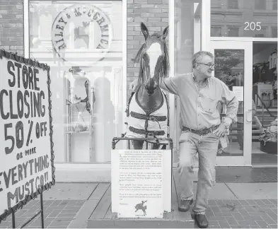  ?? CHRIS BOLIN FOR THE NATIONAL POST ?? Brian Guichon is owner of Calgary’s iconic western wear store Riley & McCormick. The business — one of Alberta’s oldest — will be closing its doors on Aug. 30 amid continuing struggles for the province’s oil and gas industry.