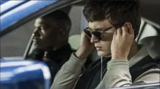  ??  ?? Ansel Elgort, right, and Jamie Foxx in a scene from "Baby Driver." Elgort plays Baby, a getaway driver by trade.