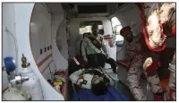  ?? AP/ISNA/ALIREZA MOHAMMADI ?? Wounded military personnel are moved into an ambulance Saturday after the shooting in Ahvaz, Iran.