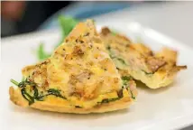  ??  ?? Salmon, spinach and leek quiche.