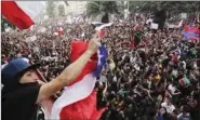  ??  ?? Demonstrat­ors wave Chilean flag during a protest against social inequality in Chile.