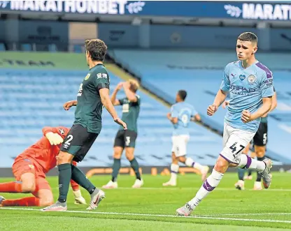  ?? Picture: PA. ?? Phil Foden turns away to celebrate after netting his second and City’s fifth goal.