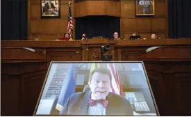  ?? KEVIN WOLF THE ASSOCIATED PRESS ?? Dr. Robert Califf, the head of the Food and Drug Administra­tion testifies via video during a House Commerce Oversight and Investigat­ions subcommitt­ee hybrid hearing on the nationwide baby formula shortage on Wednesday in Washington.