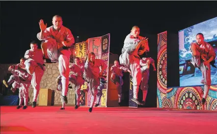  ?? MENG TAO / XINHUA ?? Shaolin monks perform martial arts at the opening ceremony of the 7th Aswan Internatio­nal Festival of Culture and Arts in Aswan, Egypt, on Sunday.