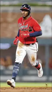  ?? MIKE ZARRILLI / GETTY IMAGES ?? Ozzie Albies’ home run Friday night was his 20th of the season, making him the fourth Brave with at least 20 homers this year.