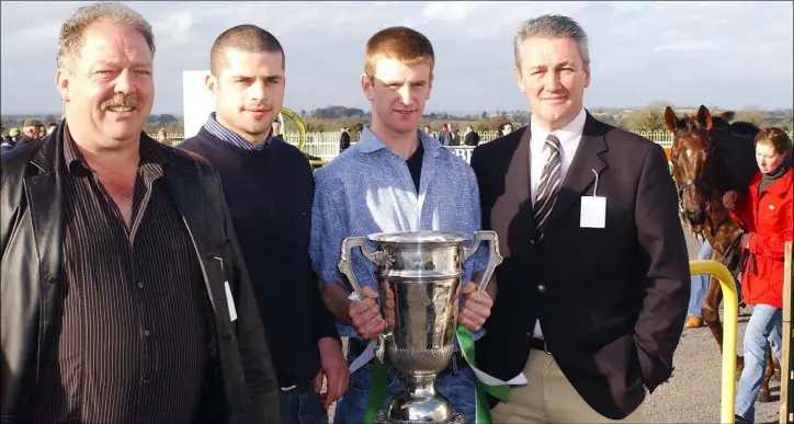  ??  ?? Displaying the Joe Ward....... Gerard Cumiskey, Colin Goss, Damien White and Padraic Connor, St. P atrick’s GFC pictured at the Louth County Board’s “Wee County Goes Racing” in November 2003 in Navan.