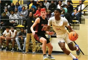  ?? (Pine Bluff Commercial/I.C. Murrell) ?? Khamani Cooper of Watson Chapel attacks the basket against Keaton Stone of White Hall in the second half Tuesday at Watson Chapel’s Leslie Henderson Gymnasium.