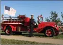  ??  ?? Avon Fire Capt. Joe Reising rings the fire truck bell to commemorat­e victims of the Sept. 11, 2001, terror attacks.