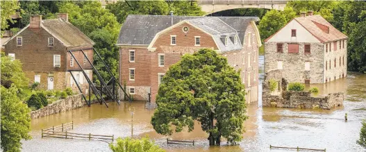  ?? APRIL GAMIZ/THE MORNING CALL ?? Flooding in the Colonial Industrial Quarter in Bethlehem on Tuesday during Tropical Storm Isaias.