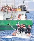  ??  ?? ON PATROL: A US Coast Guard vessel inspects a fishing boat off Honolulu.