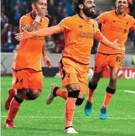  ?? CAMERASPOR­T ?? Dominant: Salah (centre) struck in Liverpool’s 5-0 romp