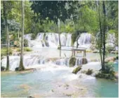  ??  ?? (left) Memorable sight ... Tad Sae Waterfall.
(right) A Khmu couple and Hmong guides dine in the village; and (far right) kayaking on the Nam Khan River.