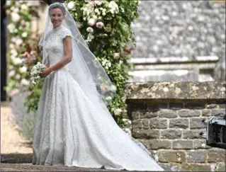  ?? WPA POOL, GETTY IMAGES ?? Pippa Middleton arrives for her wedding to James Matthews at St Mark’s Church in Englefield Green, England, on Saturday.