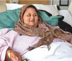  ?? Courtesy: Burjeel Hospital ?? Eman Abdul Atti in her hospital bed at Burjeel Hospital Abu Dhabi. The 36-year-old Egyptian has had her nasogastri­c feeding tube removed, and is able to take her medicines orally.