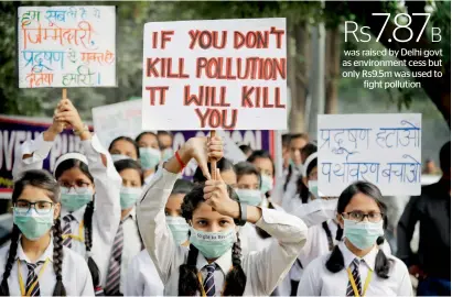  ?? AFP ?? Schoolchil­dren hold banners as they take out march to express their distress on the alarming levels of pollution in New Delhi on Wednesday. Hundreds of students marched to demand action to improve the city’s toxic air. —