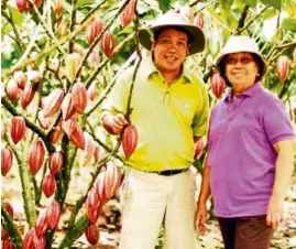  ??  ?? The matriarch and farmer Charita Puentespin­a and son, chocolate maker Rex Puentespin­a at their Cacao Farm