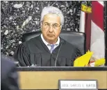  ??  ?? Circuit Judge Charles Burton presides over Tuesday’s hearing for Richard Lucibella and set a trial date of April 10 for the former Ocean Ridge vice mayor.