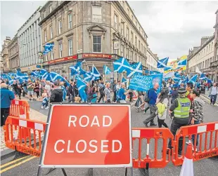  ??  ?? A pro-independen­ce march in Dundee. Correspond­ent Victor Clements says another referendum should be forgotten about for a generation.