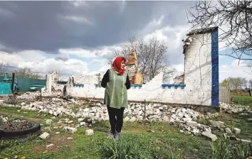  ?? Reuters ?? Lyubov Lenko, 61, reacts as she shows her house that according to her was destroyed by shelling, amid the Russian invasion of Ukraine in Budy, Chernihiv region, yesterday.