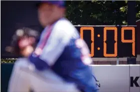  ?? JOHN MINCHILLO — THE ASSOCIATED PRESS ?? A pitch clock is shown during a minor-league game between the Brooklyn Cyclones and Greensboro Grasshoppe­rs, on July 13, 2022.