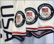  ?? EVAN AGOSTINI — INVISION — AP ?? Team USA Tokyo Olympic closing ceremony uniforms are displayed during the unveiling at the Ralph Lauren SoHo Store on in New York. Ralph Lauren is an official outfitter of the 2021 U.S. Olympic Team.