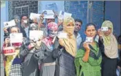  ?? ANI ?? Voters stand in queue at a polling station in Prayagraj on Sunday.