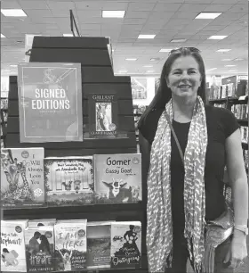  ?? BY LOANED ?? YUMA RESIDENT CLAIRE ECKARD, who is an an award-winning author, poses at a Barnes and Noble bookstore in Chandler where she was doing a book signing for most recently published book, Gallant: The Call of the Trail.