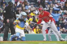  ?? MICHAEL DWYER/AP ?? LOS ANGELES ANGELS’ MIKE TROUT (27) reacts after striking out on a foul tip to Boston Red Sox’s Reese Mcguire (not shown) during the fifth inning of a game on Saturday in Boston.