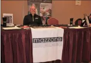  ??  ?? Corporate recruitmen­t and talent acquisitio­n coordinato­r Patrick Parkes represents Mazzone Hospitalit­y at the Restaurant Industry Career Fair on Monday in Albany.