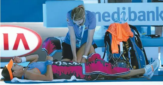  ?? Photo: GETTY IMAGES ?? Medic break: Serbia’s Ana Ivanovic receives medical attention in her quarterfin­al match against Eugenie Bouchard, of Canada, at the Australian Open in Melbourne yesterday.