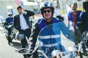  ?? (Tomer Neuberg/Flash 90) ?? BLUE AND WHITE party chairman Benny Gantz rides his motorcycle during a campaign event yesterday, ahead of the Knesset elections.