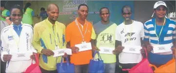  ??  ?? The top six Kenyans of the inaugural Sibu Marathon with Naum on left and Koech on second right.