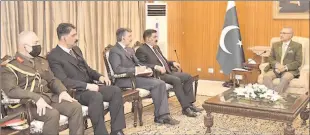  ??  ?? ISLAMABAD
A delegation of Iraqi Defence officials led by Defence Minister of Iraq, Jumma Enad President Dr Arif Alvi, at Aiwan-e-Sadr. -APP
Sadoon Al- Jibori calls on