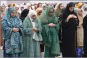 ?? DAMIAN DOVARGANES — THE ASSOCIATED PRESS ?? American Muslims women pray to mark the end of the holy month of Ramadan in Los Angeles on Wednesday.