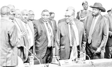  ??  ?? Bashir (second right) and Kiir (right) react during the 32nd Extraordin­ary Summit of Intergover­nmental Authority on Developmen­t (IGAD) in Addis Ababa. — AFP photo