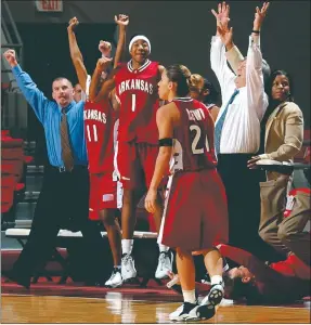  ?? AP File Photo ?? The Arkansas bench, including head coach Gary Blair (right), react after Arkansas guard India Lewis (foreground) hit the game-winning 3-pointer in the final seconds of their game versus Alabama on Feb. 2, 2003, at Coleman Coliseum in Tuscaloosa, Ala.