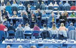  ?? ROBERT PERRY/EPA ?? Election officials count votes Thursday in Glasgow, Scotland. Exit polls showed that Prime Minister Theresa May’s Conservati­ve Party could end up falling short of a majority.