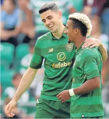  ??  ?? ■ Tom Rogic and Scott Sinclair celebrate in Belfast.