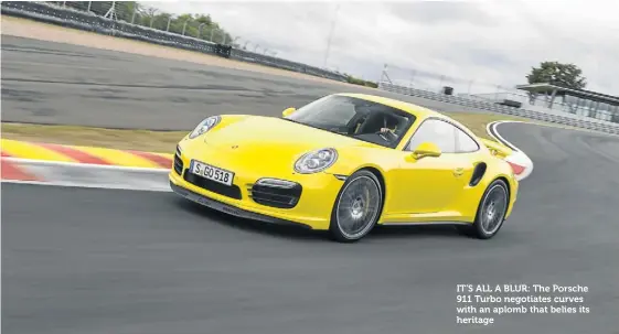  ??  ?? IT’S ALL A BLUR: The Porsche 911 Turbo negotiates curves with an aplomb that belies its heritage