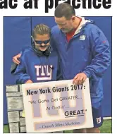  ?? Brian Lewis ?? A LOT ALIKE: Peter Costigan, aka Mini McAdoo, shares a moment with Ben McAdoo at Giants practice.