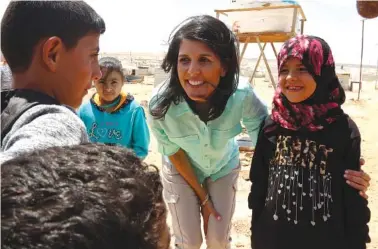  ?? THE ASSOCIATED PRESS ?? U.S. Ambassador to the United Nations Nikki Haley speaks with Syrian children at Zaatari Refugee Camp on Sunday in Jordan.