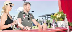  ?? ?? LIFE CHOICE Festival attendees have nonalcohol­ic drinks at The New Bar, making a change from the heavy drinking that was part the mammoth festival.