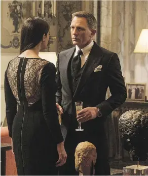  ?? MGM ?? Monica Bellucci, left, and Daniel Craig appear in Spectre. Much was made of their closeness in age, but her role was brief and predictabl­e.